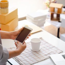 Owner of online seller taking product photos for uploading to website, online shop, young woman hand